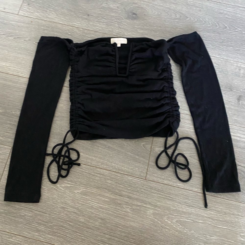 The Sun Becomes Her black off shoulders top